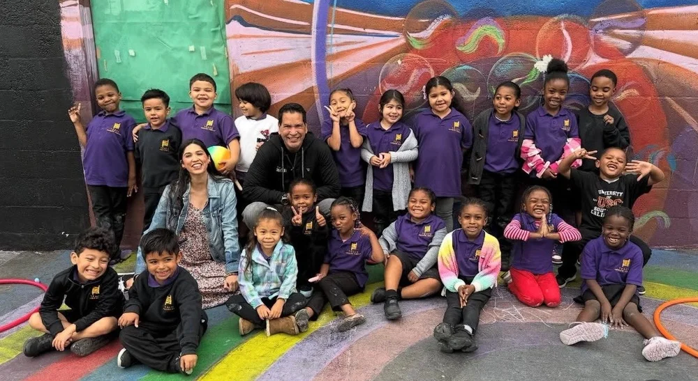 A class of students and teachers celebrating together at school